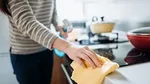 A person cleaning their kitchen